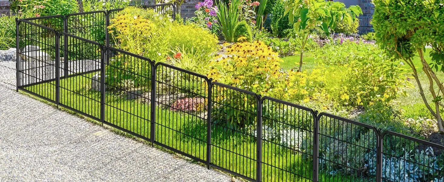 Metal dog fence with gate installed in garden, no-dig animal barrier and playpen for yard and camping.